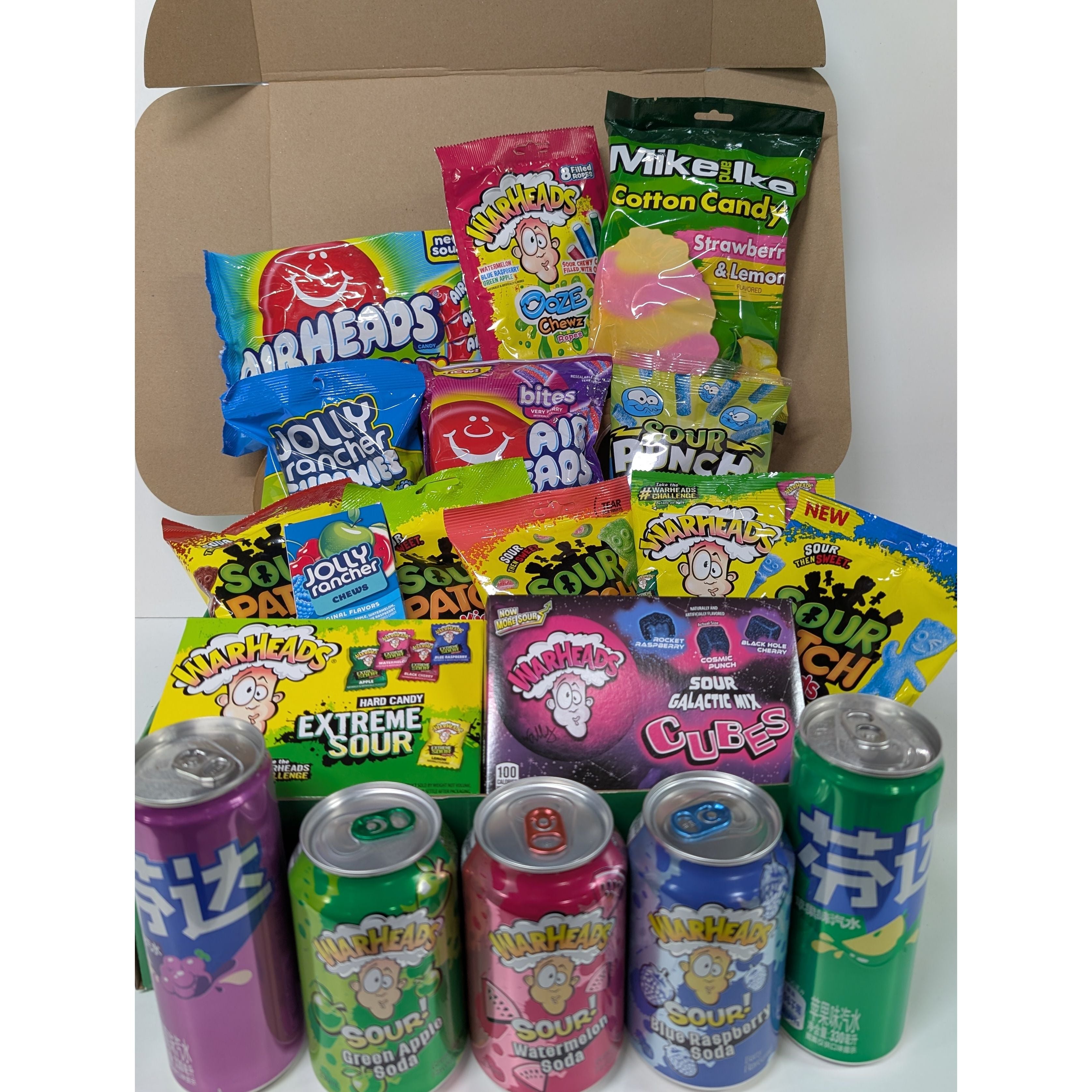 Assorted candy and drink package with colorful packaging on a white background